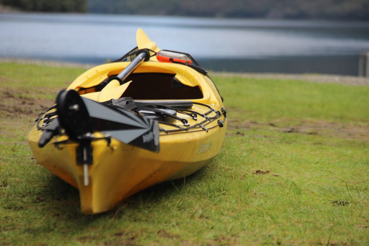 Yellow kayak with a rudder attached