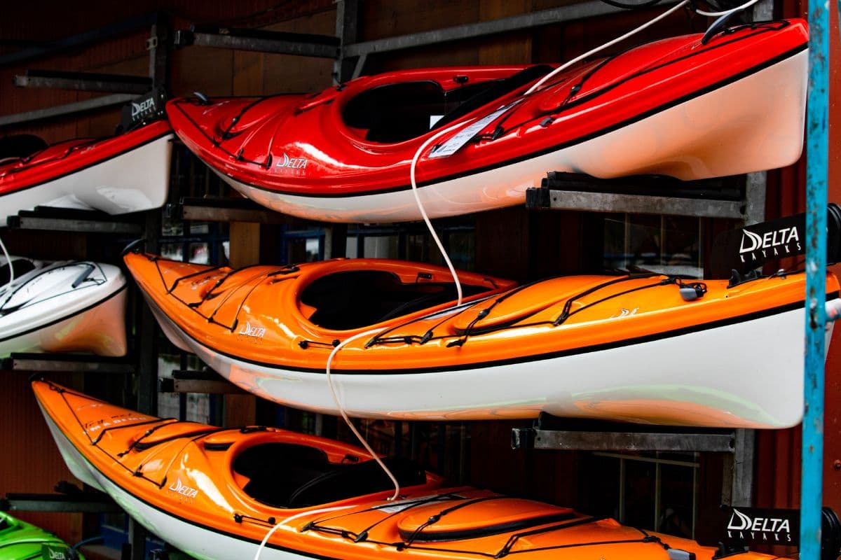 Multiple brand new kayaks displayed inside a store
