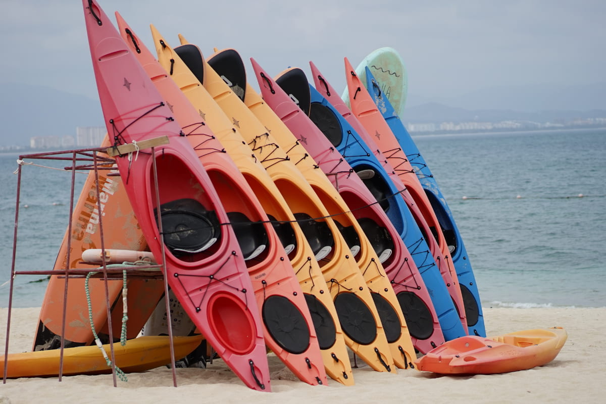 Multiple kayaks locked up to a rack