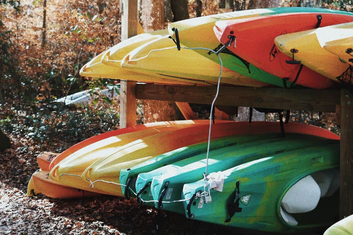 Multiple kayaks stored in a rack outdoors