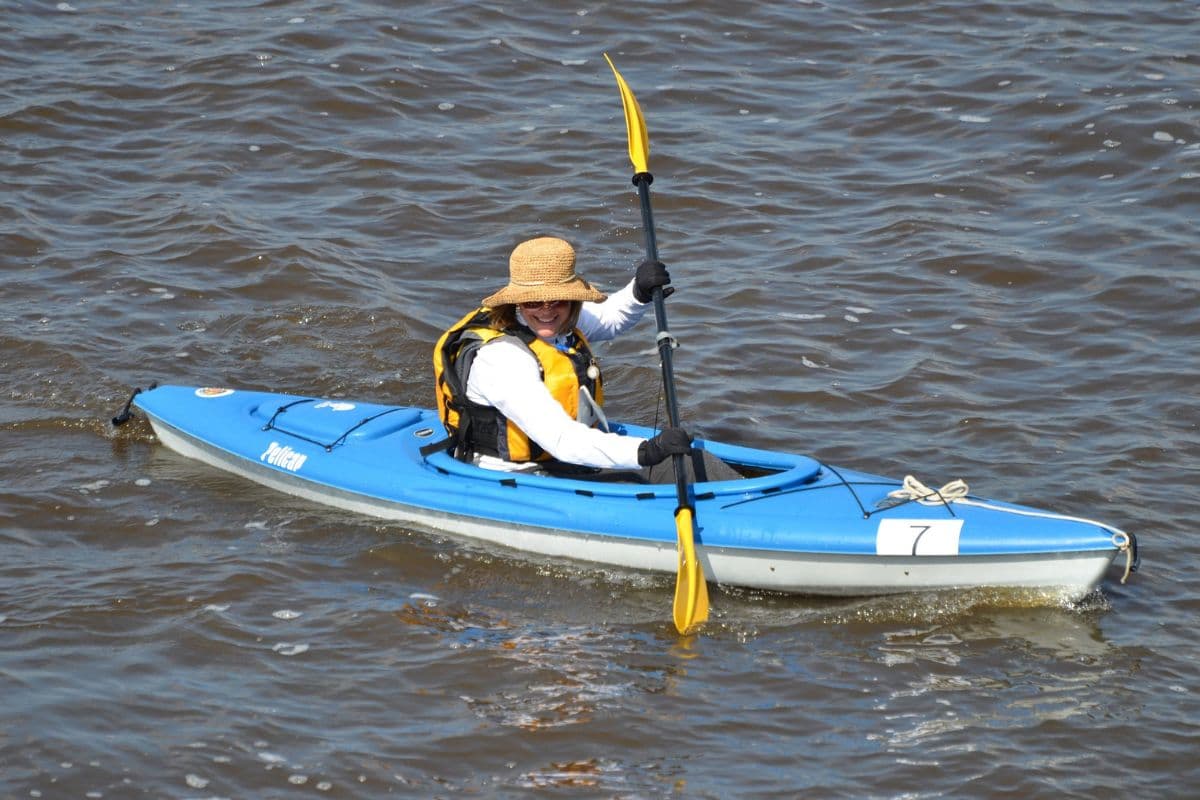Woman paddling on a recreational kayak