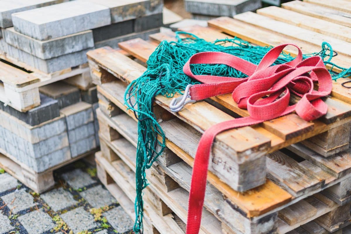 Red straps on wooden pallets stack