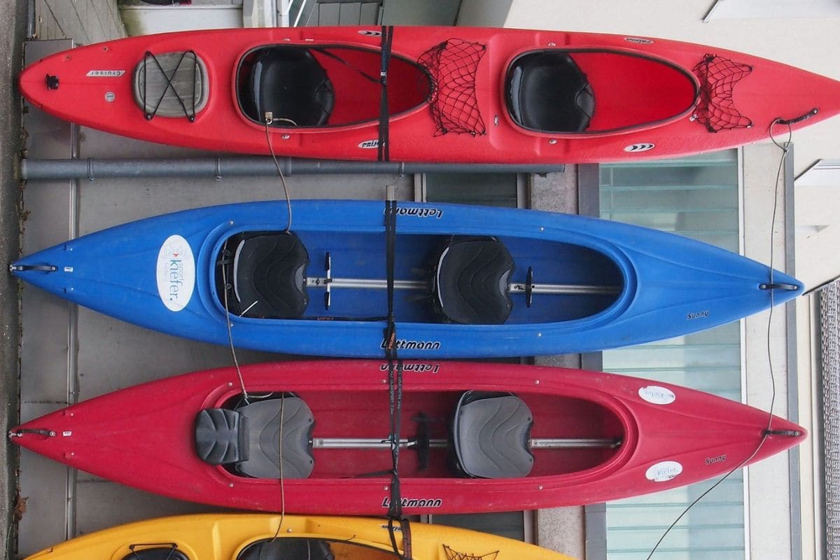 Three tandem kayaks with two separate seats inside the hull