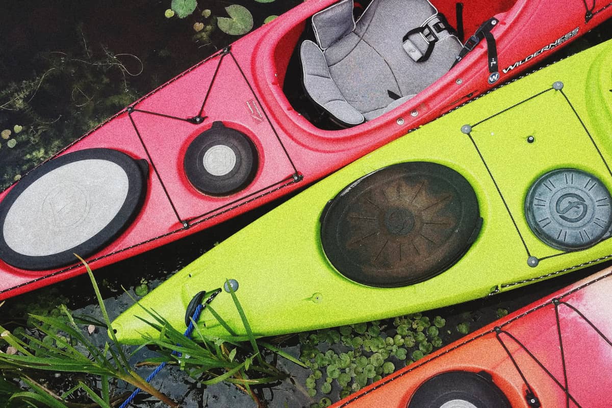 Top view of 3 kayaks showing the area where the scupper holes would be